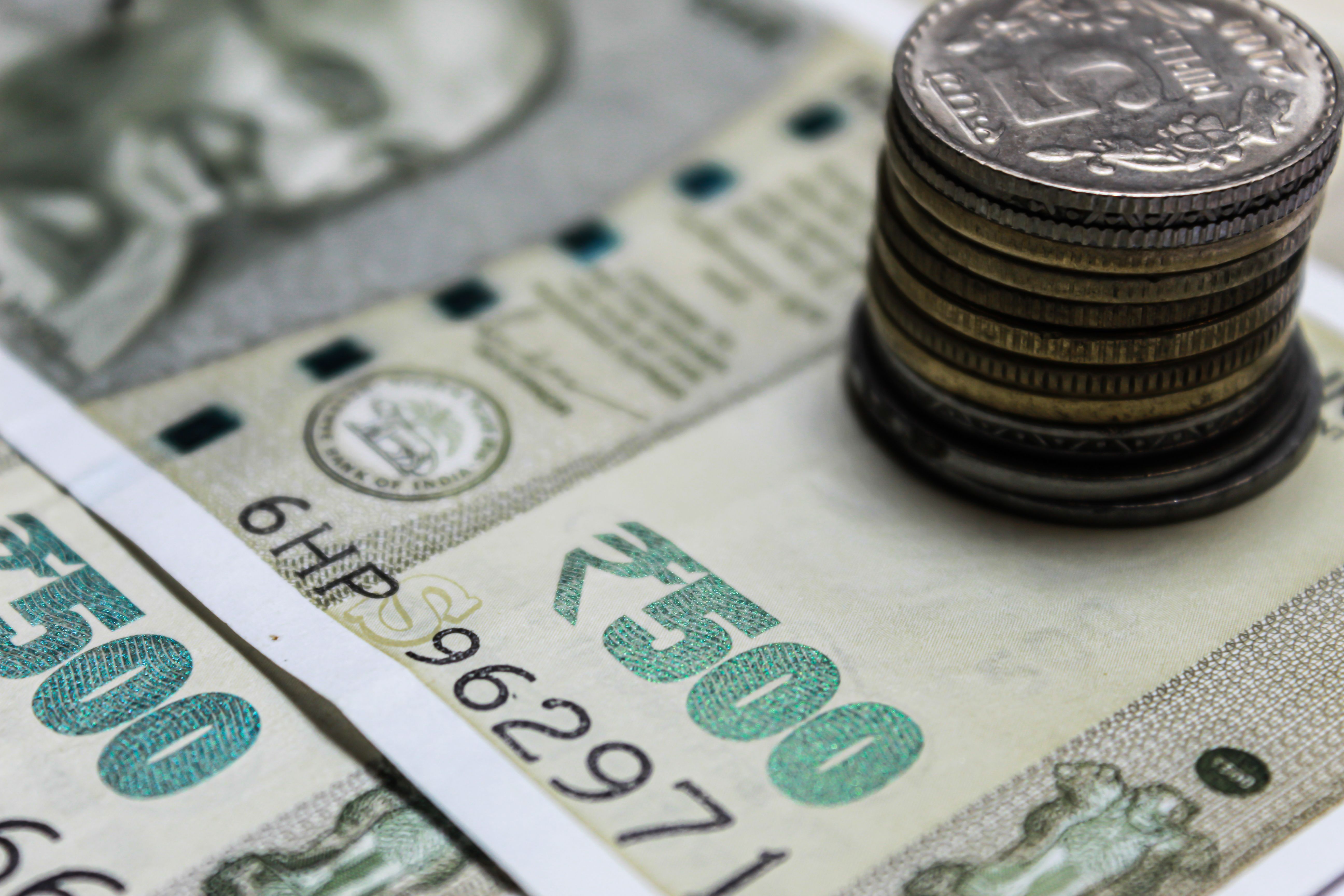 Gold scales weighing dollar and yen symbols